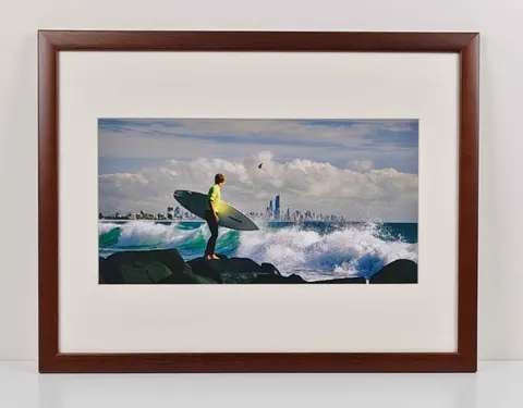 Surfer at Rocky Shoreline